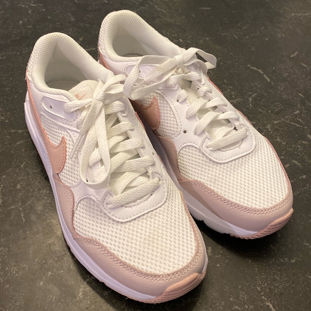 Nike pink and white running shoes